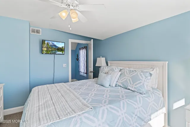 a bathroom with a shower sink and mirror