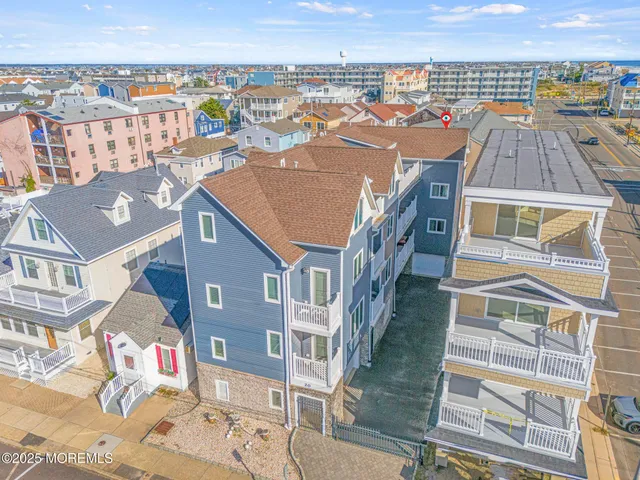 a view of a blue building with many windows