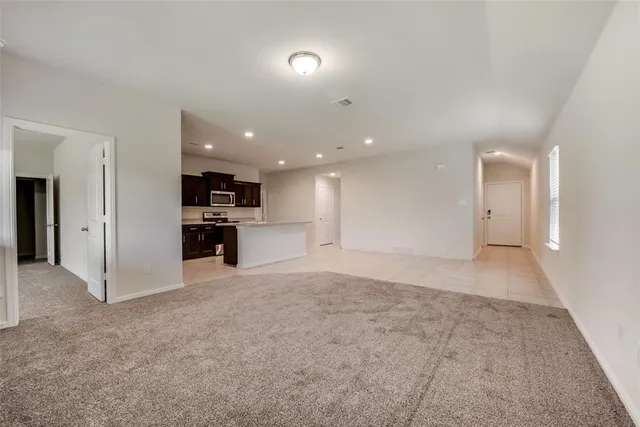 a view of a kitchen with a sink and a stove top oven