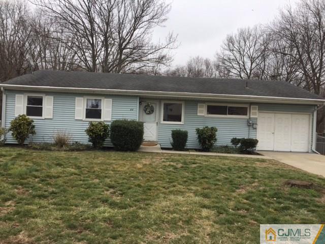 44 Clemson Road Old Bridge, NJ 08859 - Photo 1 of 12 a house that has a tree in front of it
