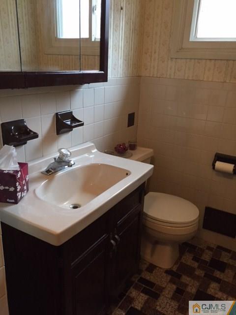 44 Clemson Road Old Bridge, NJ 08859 - Photo 5 of 12 a bathroom with a sink toilet and a mirror