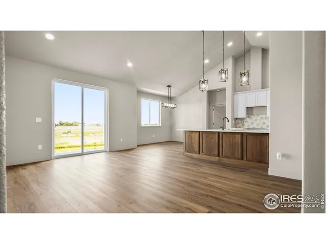 a bathroom with a sink window and a mirror
