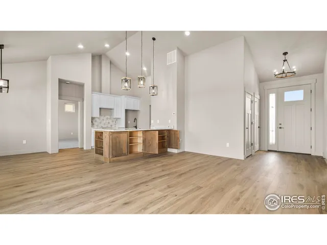 a bathroom with a sink a large mirror and shower