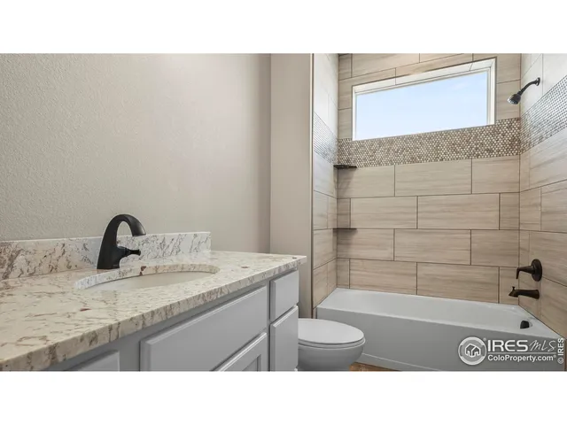 a bathroom with a sink a bath tub and a shower