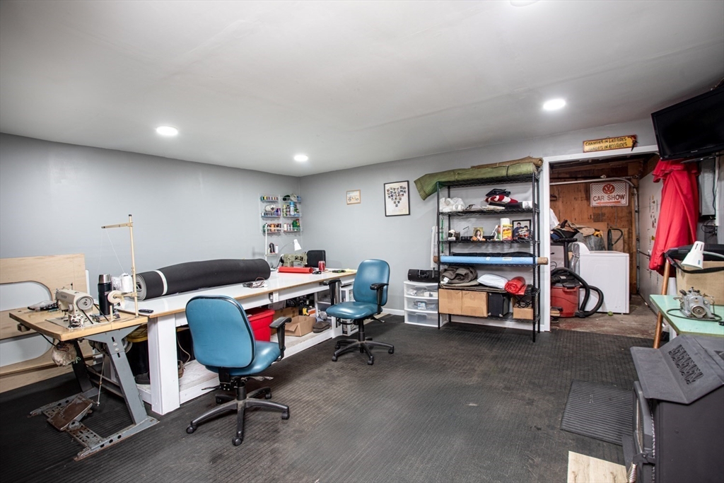 415 Anthony Street Fall River, MA 02721 - Photo 12 of 16 a room with furniture and a flat screen tv