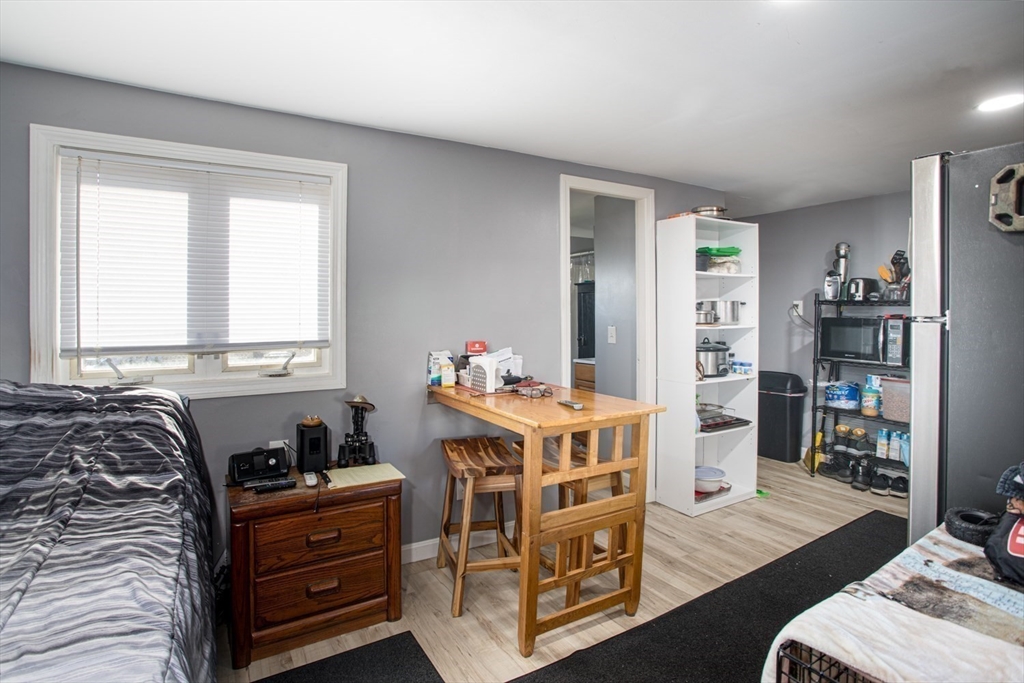 415 Anthony Street Fall River, MA 02721 - Photo 4 of 16 a bed room with a bed and a window