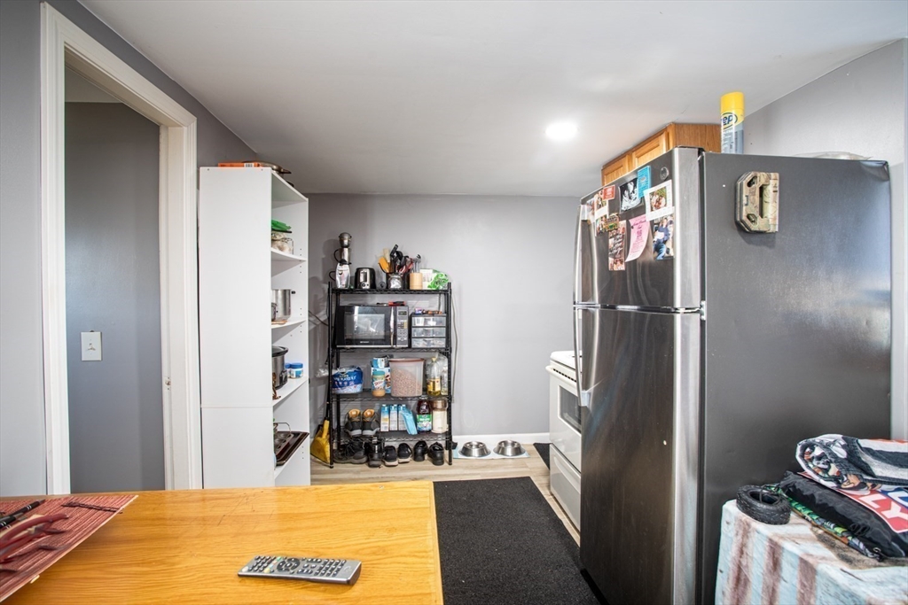 415 Anthony Street Fall River, MA 02721 - Photo 5 of 16 a bedroom with a bed and a cabinets