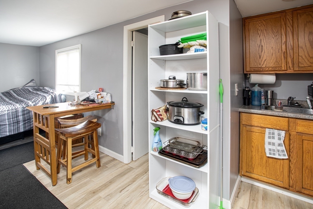 415 Anthony Street Fall River, MA 02721 - Photo 7 of 16 a room with furniture and a wooden floor