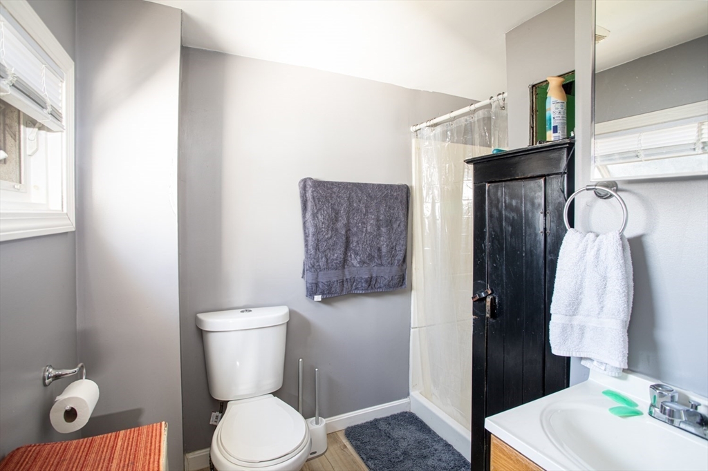 415 Anthony Street Fall River, MA 02721 - Photo 9 of 16 a bathroom with a toilet sink and shower