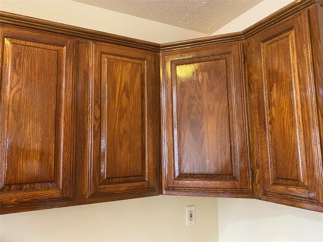 a view of door with wooden walls