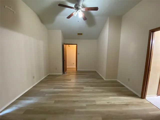 a view of an empty room and window