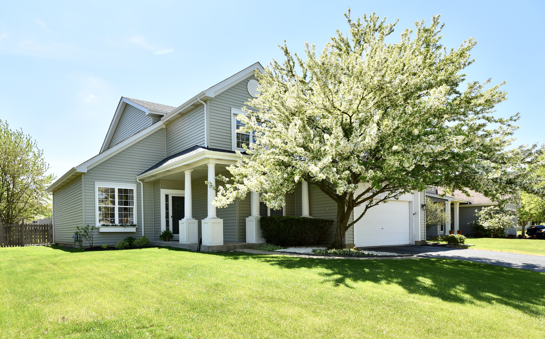 1389 Lily Cache Lane Bolingbrook, IL 60490 - Photo 44 of 45 a front view of a house with a yard and garage