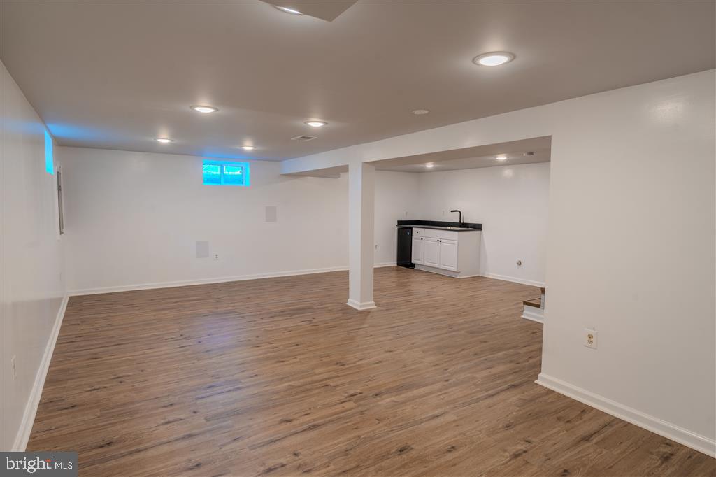 12324 Centerhill Street Silver Spring, MD 20902 - Photo 20 of 24 a view of empty room with wooden floor