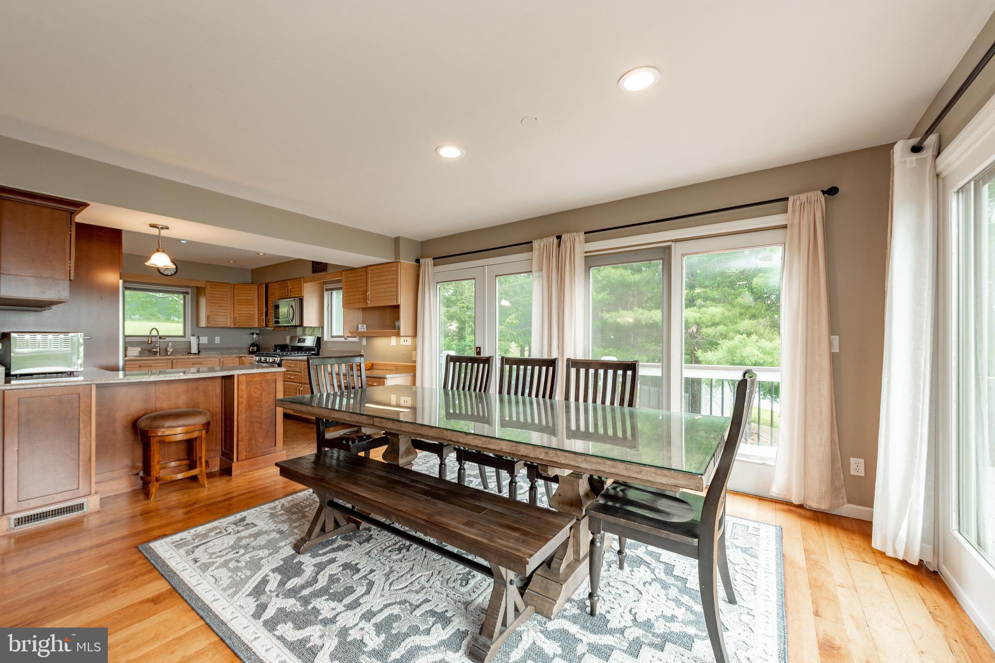 467 Paradise Ridge Road Oakland, MD 21550 - Photo 12 of 64 a view of a dining room with furniture window and wooden floor