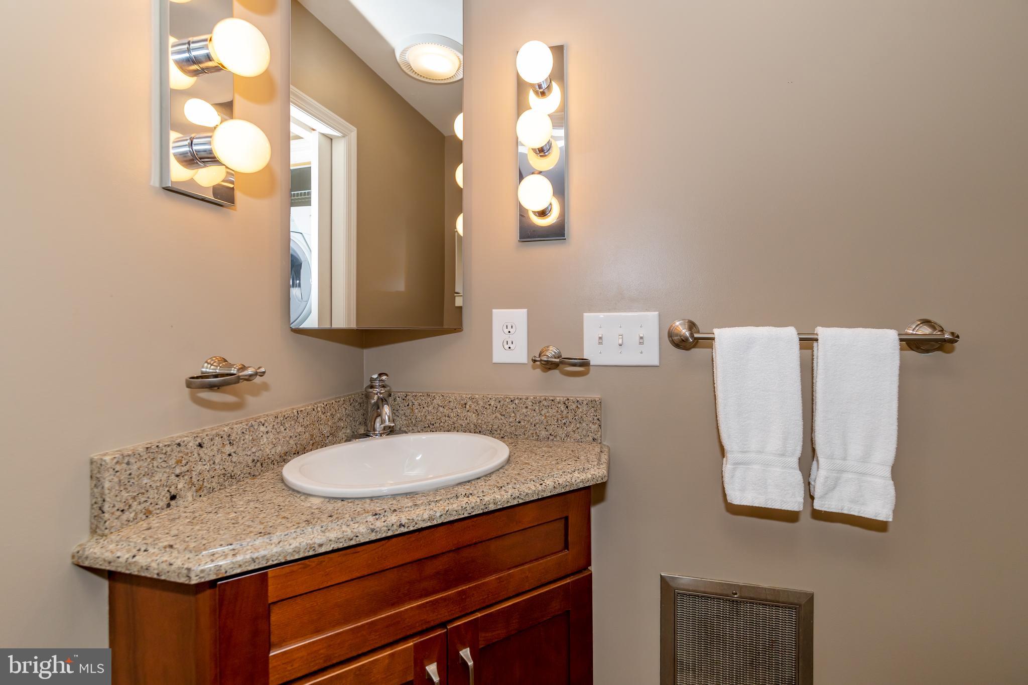 467 Paradise Ridge Road Oakland, MD 21550 - Photo 16 of 64 a bathroom with a sink and a mirror