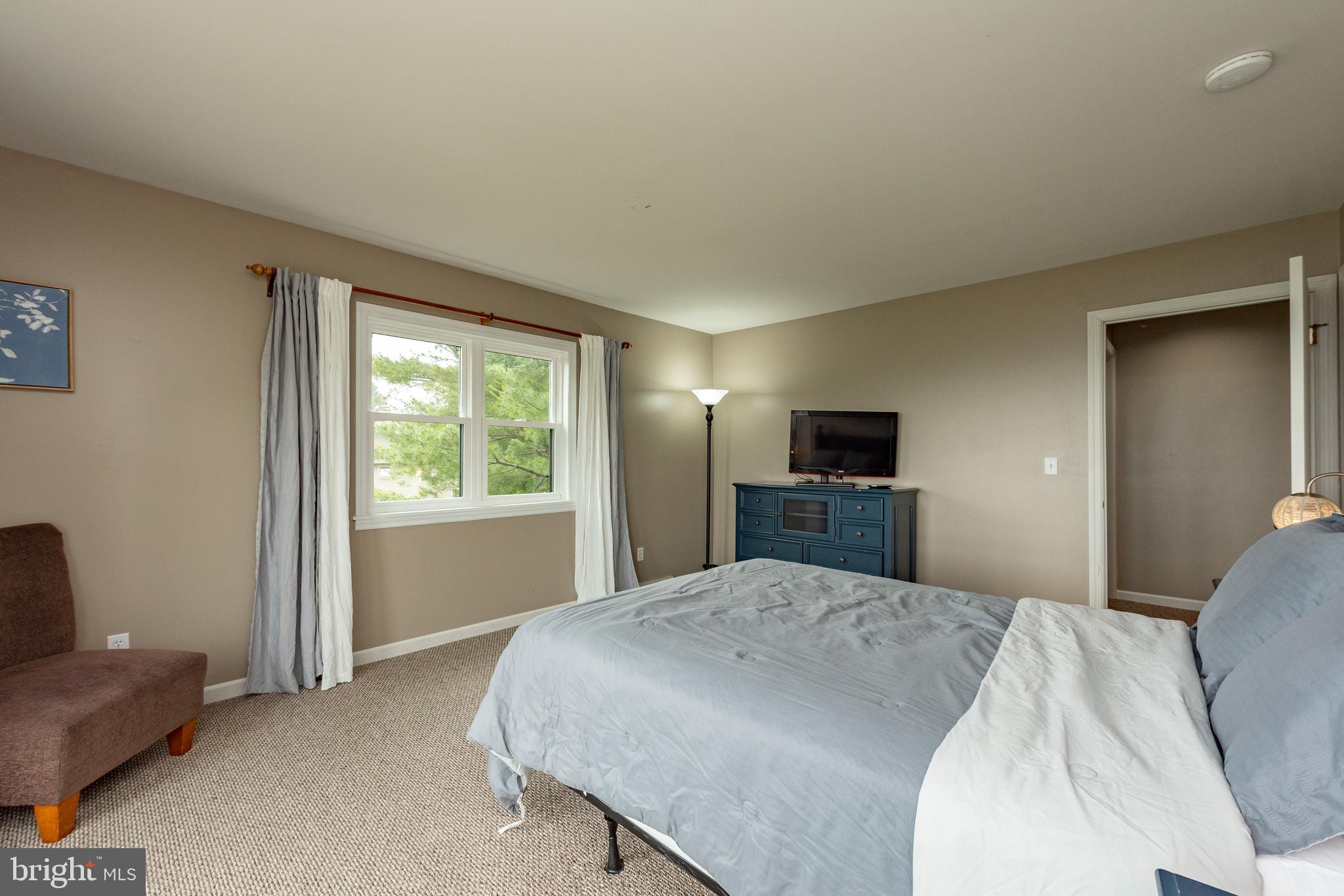 467 Paradise Ridge Road Oakland, MD 21550 - Photo 38 of 64 a bedroom with a bed and a television