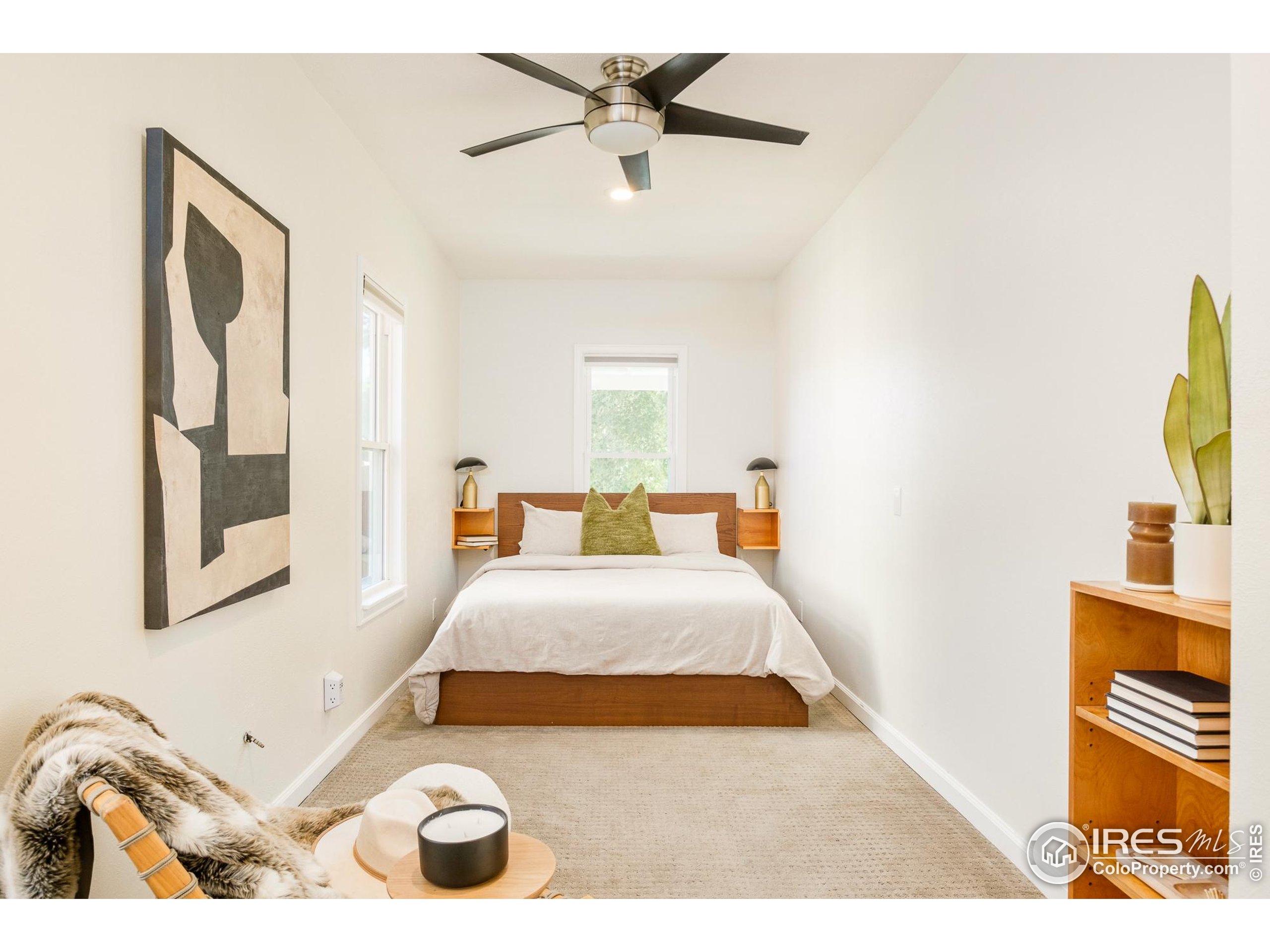4635 Elm Court Denver, CO 80211 - Photo 12 of 30 a bedroom with a bed and a chandelier
