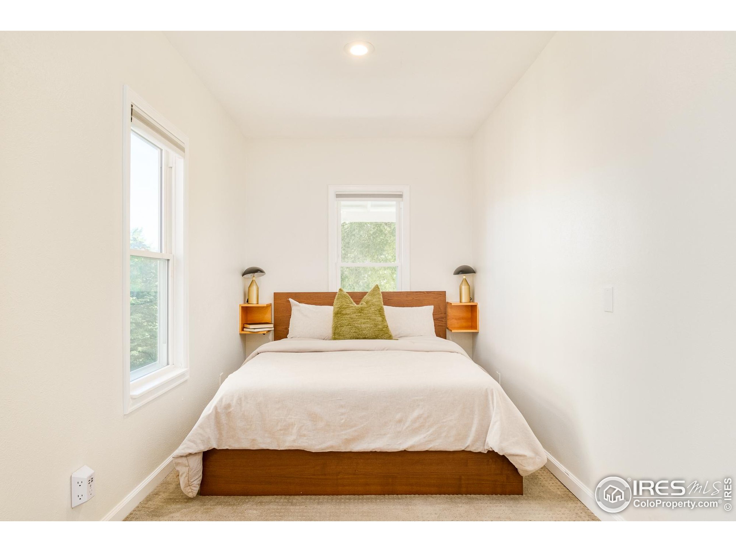 4635 Elm Court Denver, CO 80211 - Photo 13 of 30 a bedroom with a bed and window