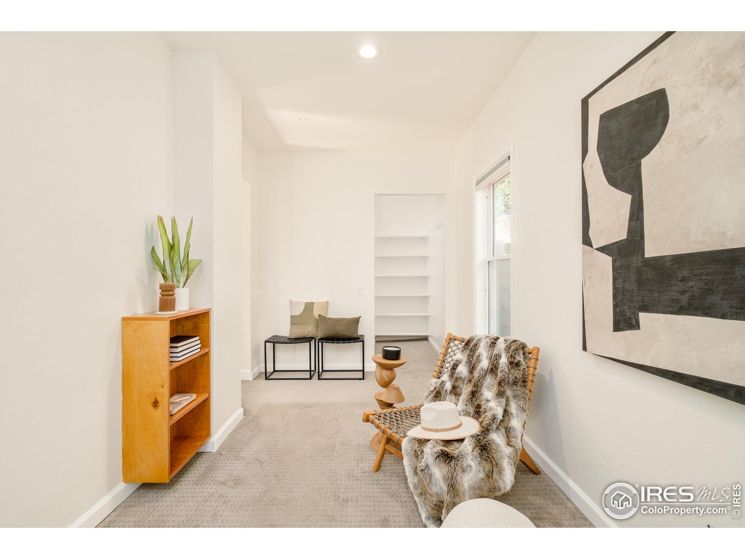 4635 Elm Court Denver, CO 80211 - Photo 15 of 30 a living room with furniture and a painting on the wall