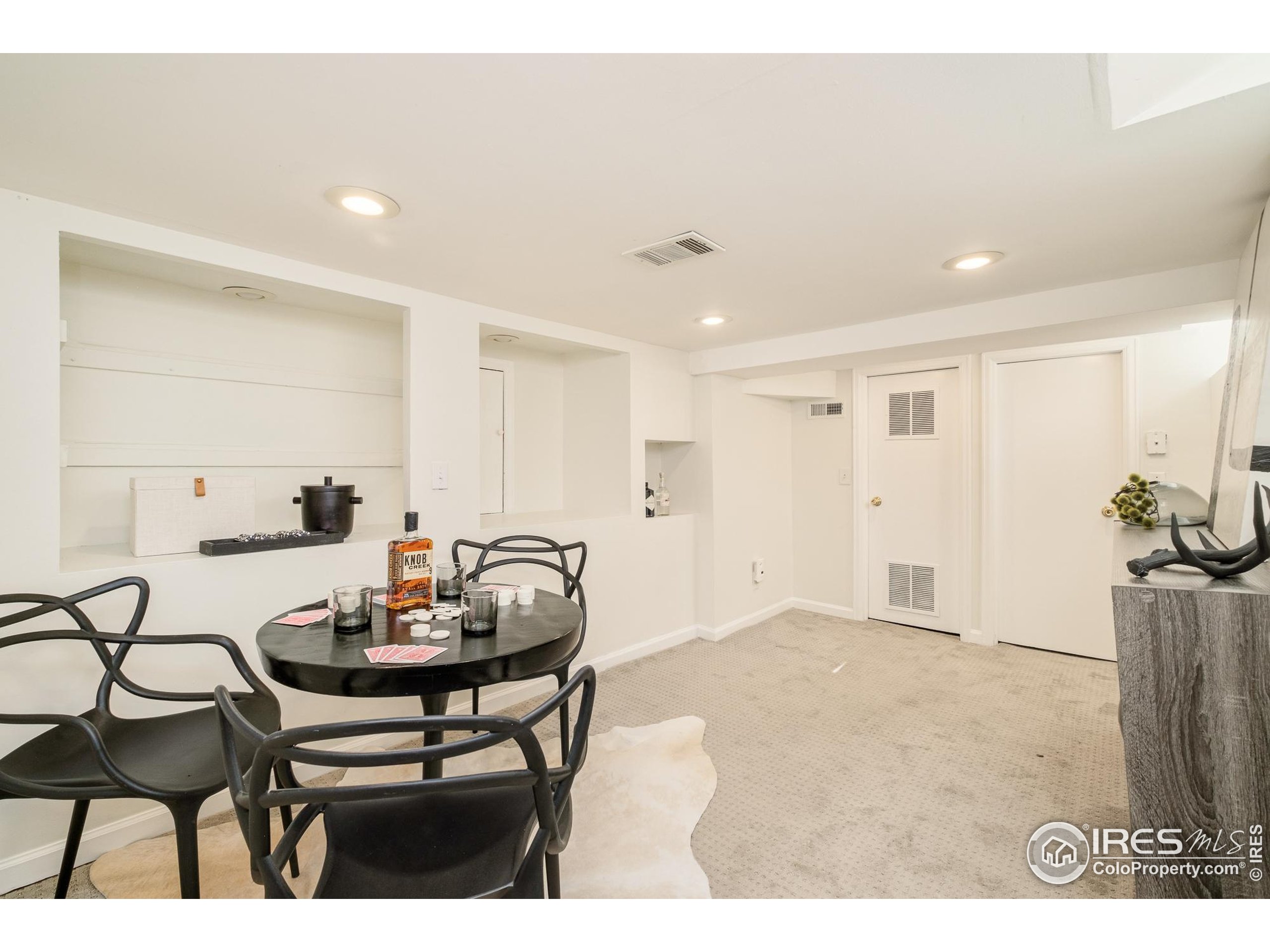 4635 Elm Court Denver, CO 80211 - Photo 18 of 30 a view of a dining room with furniture and wooden floor