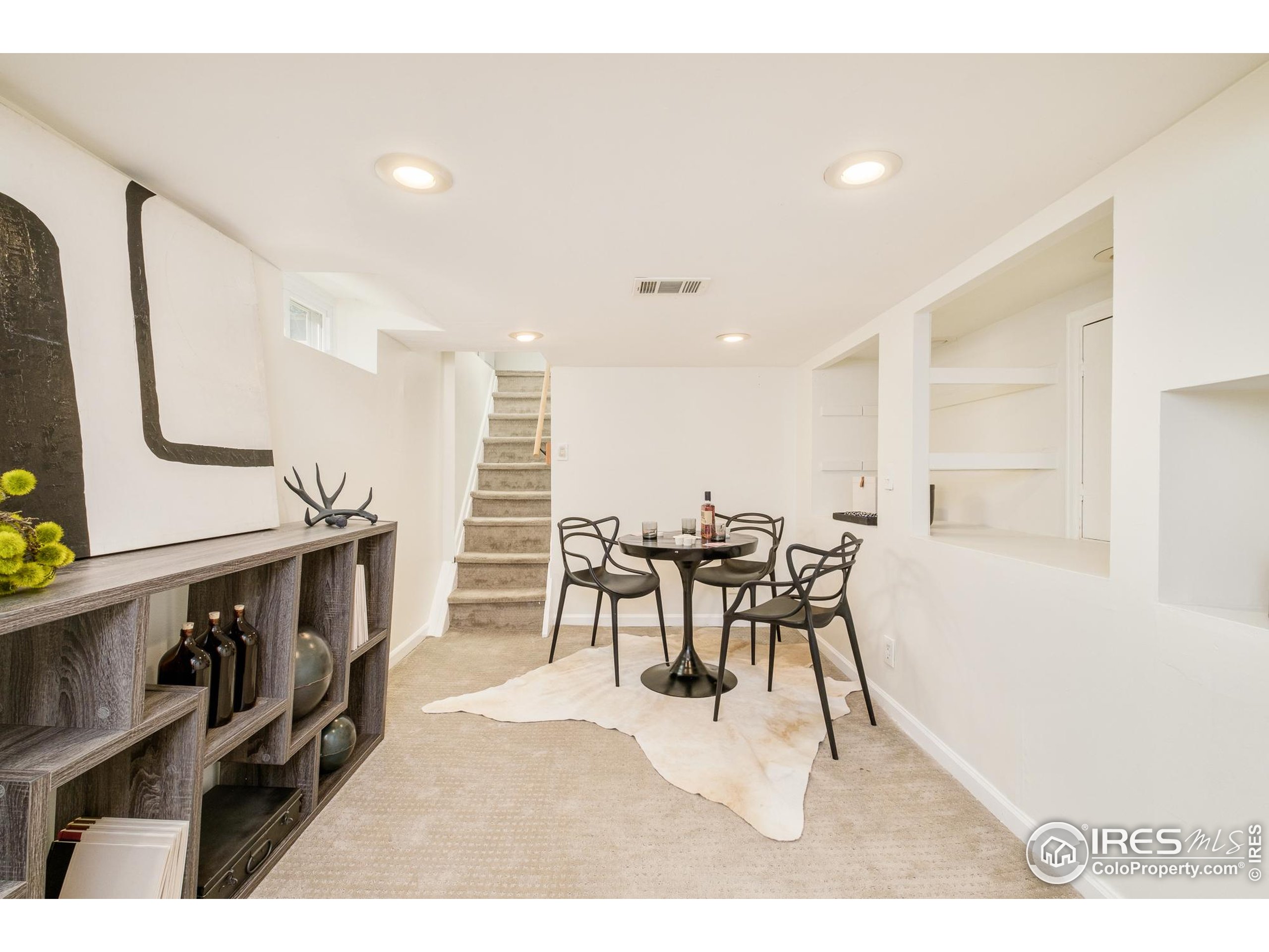 4635 Elm Court Denver, CO 80211 - Photo 21 of 30 a view of a dining room with furniture and a kitchen
