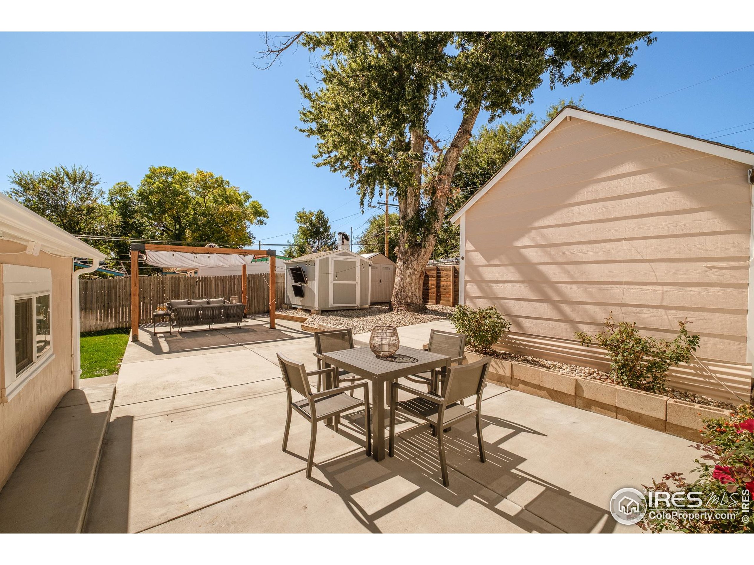 4635 Elm Court Denver, CO 80211 - Photo 23 of 30 a view of a patio with table and chairs and potted plants