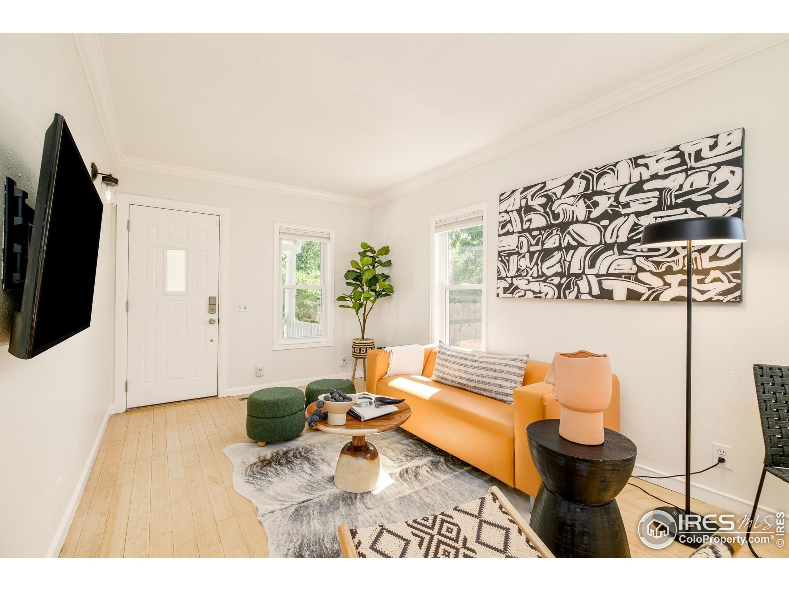 4635 Elm Court Denver, CO 80211 - Photo 3 of 30 a living room with furniture and a flat screen tv