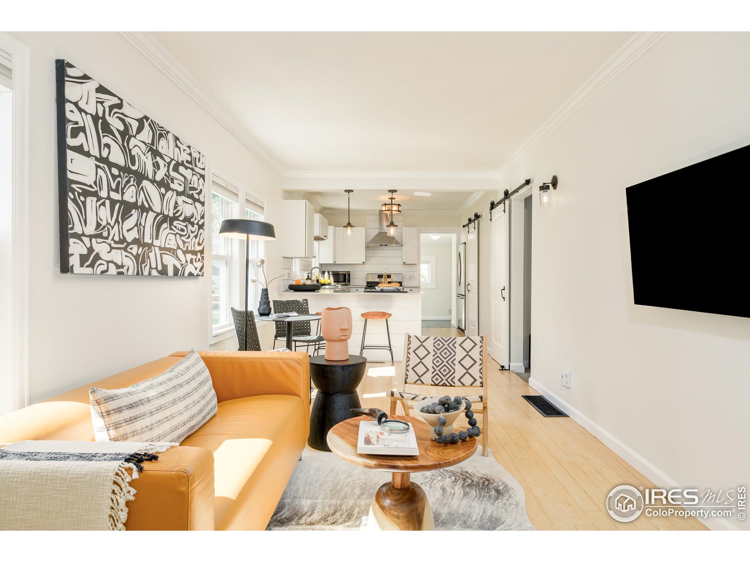 4635 Elm Court Denver, CO 80211 - Photo 4 of 30 a living room with furniture and a flat screen tv