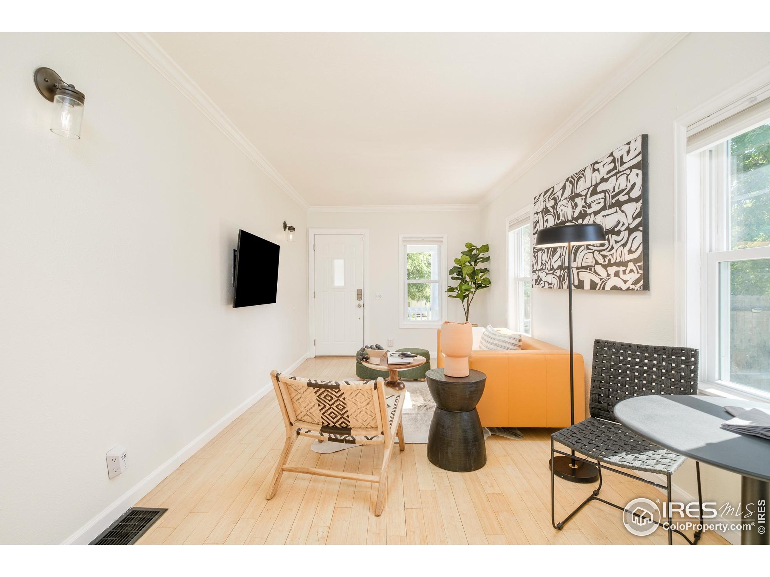 4635 Elm Court Denver, CO 80211 - Photo 6 of 30 a living room with furniture and a flat screen tv