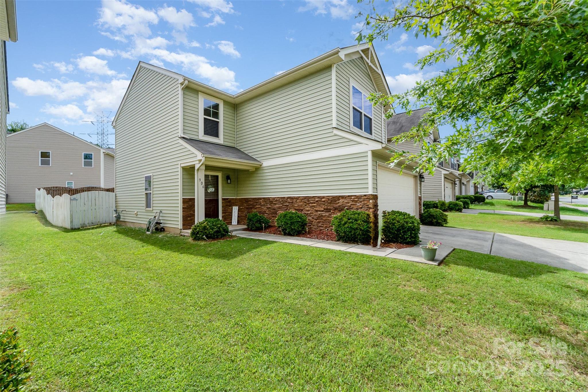 906 Rook Road Charlotte, NC 28216 - Photo 2 of 25 a view of a house with backyard and a tree