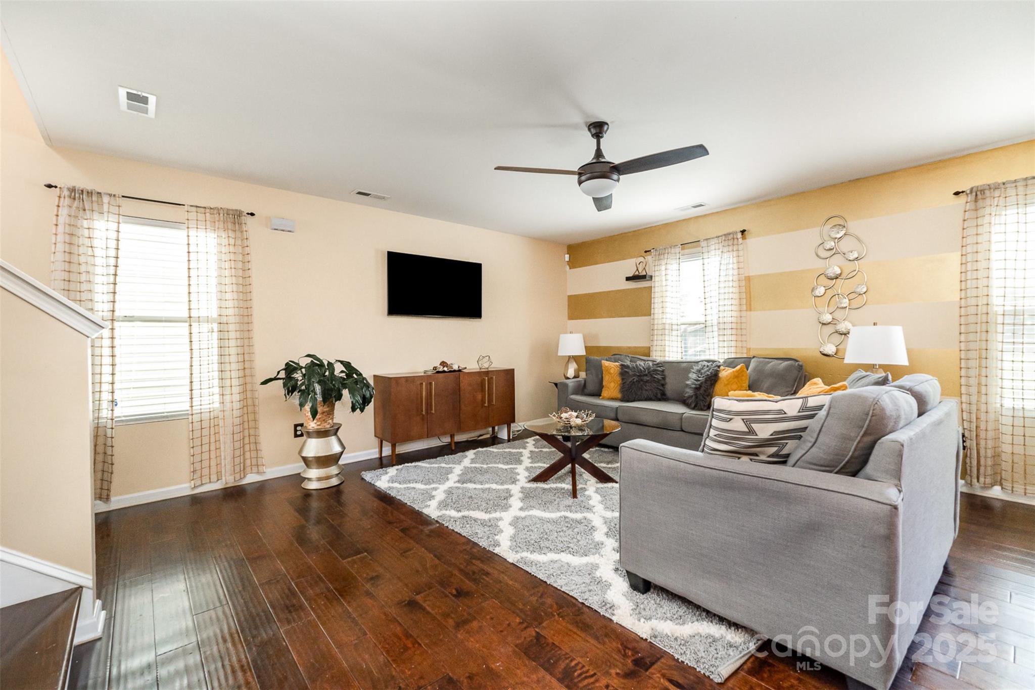 906 Rook Road Charlotte, NC 28216 - Photo 5 of 25 a living room with furniture and a flat screen tv