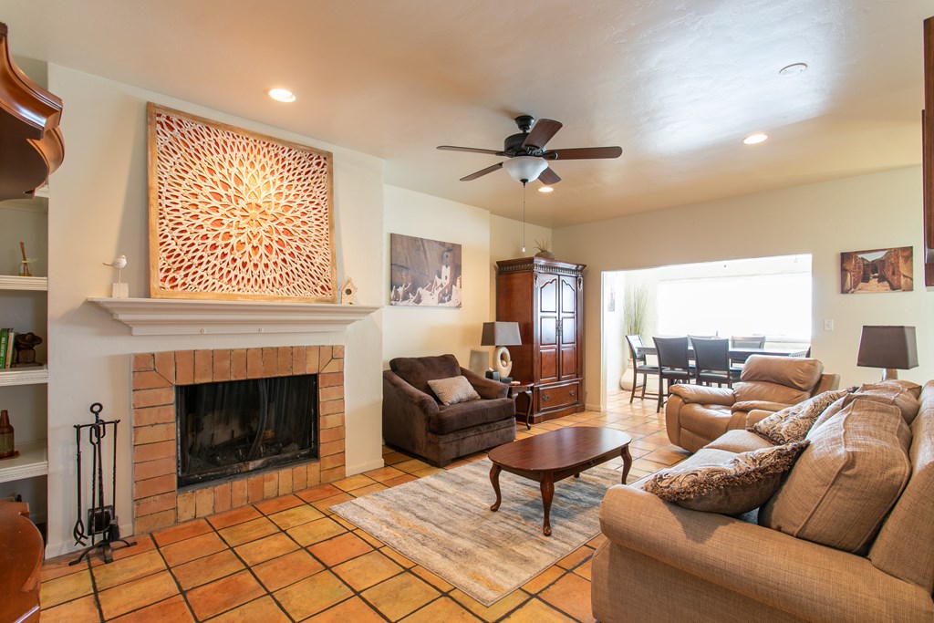 541 D Sand Bend Kerrville, TX 78028 - Photo 11 of 41 a living room with furniture a fireplace and a large window