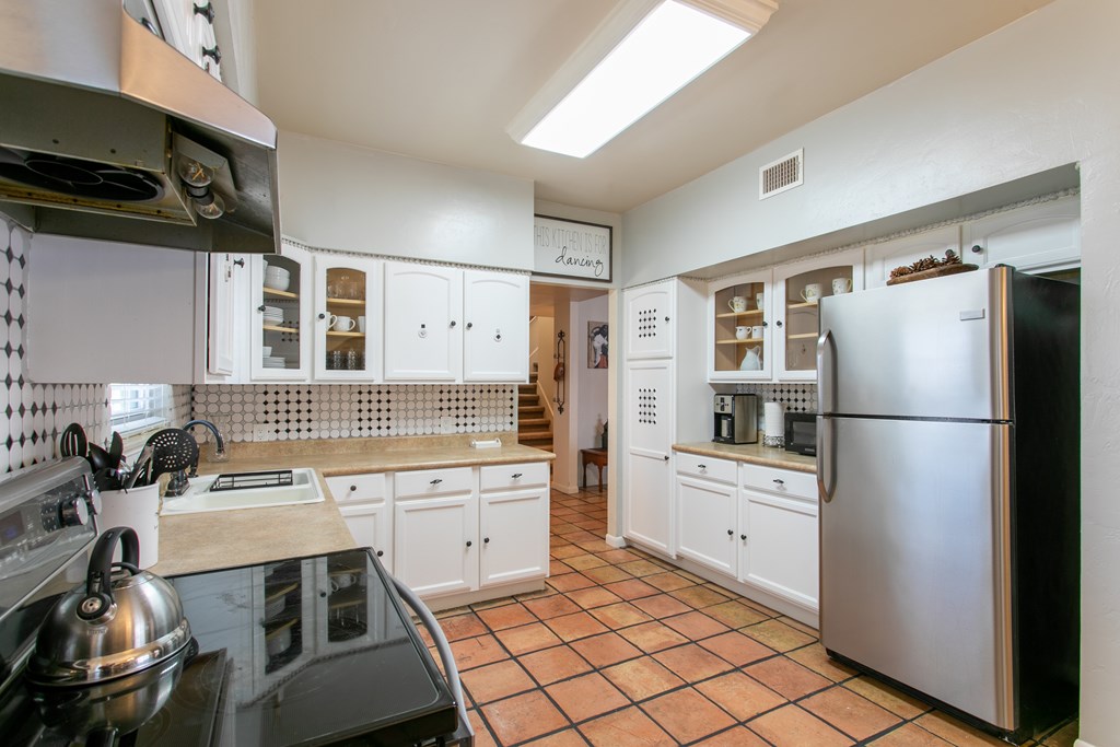 541 D Sand Bend Kerrville, TX 78028 - Photo 18 of 41 a kitchen with a sink appliances and cabinets