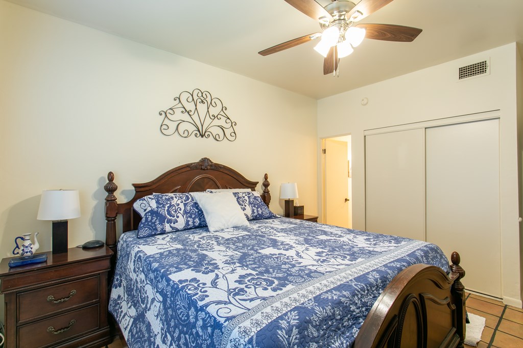 541 D Sand Bend Kerrville, TX 78028 - Photo 22 of 41 a bedroom with a bed and a chandelier