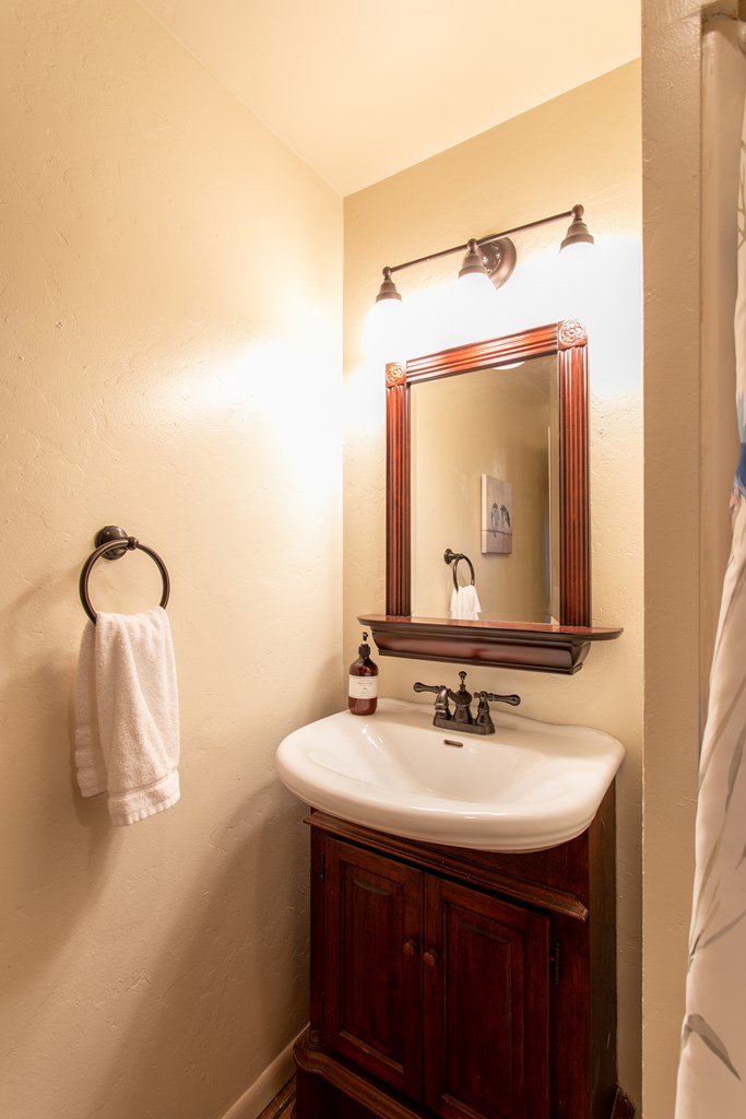 541 D Sand Bend Kerrville, TX 78028 - Photo 24 of 41 a bathroom with a sink and a mirror