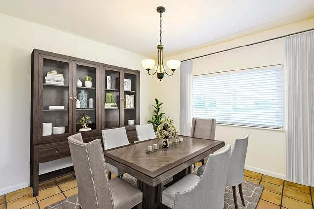 a view of a dining room with furniture window and outside view