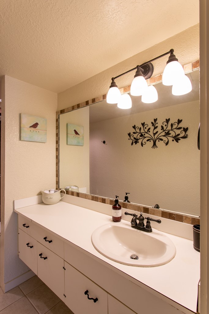 541 D Sand Bend Kerrville, TX 78028 - Photo 31 of 41 a bathroom with a sink and a mirror
