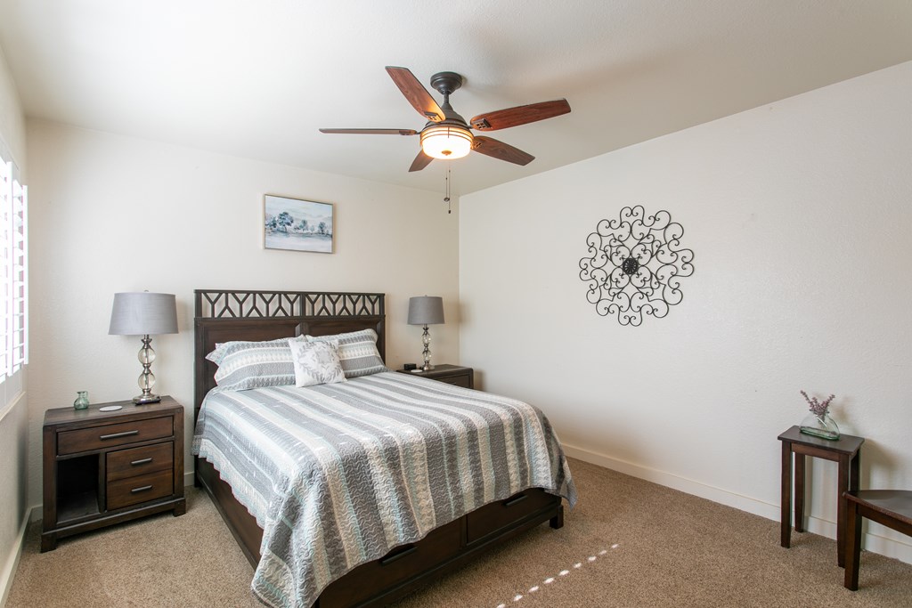 541 D Sand Bend Kerrville, TX 78028 - Photo 37 of 41 a bedroom with a bed and a chandelier