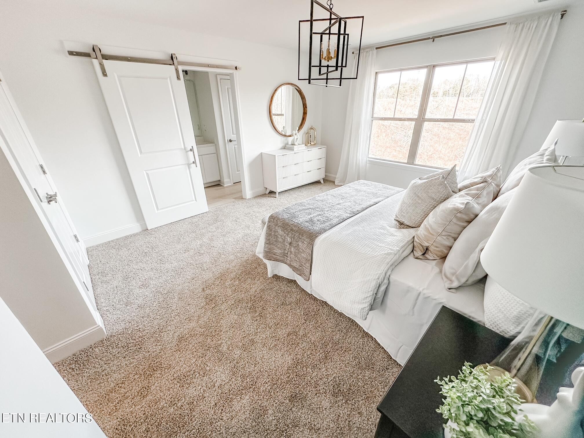 8405 Whisper Lane Powell, TN 37849 - Photo 17 of 39 a bedroom with a bed and a window