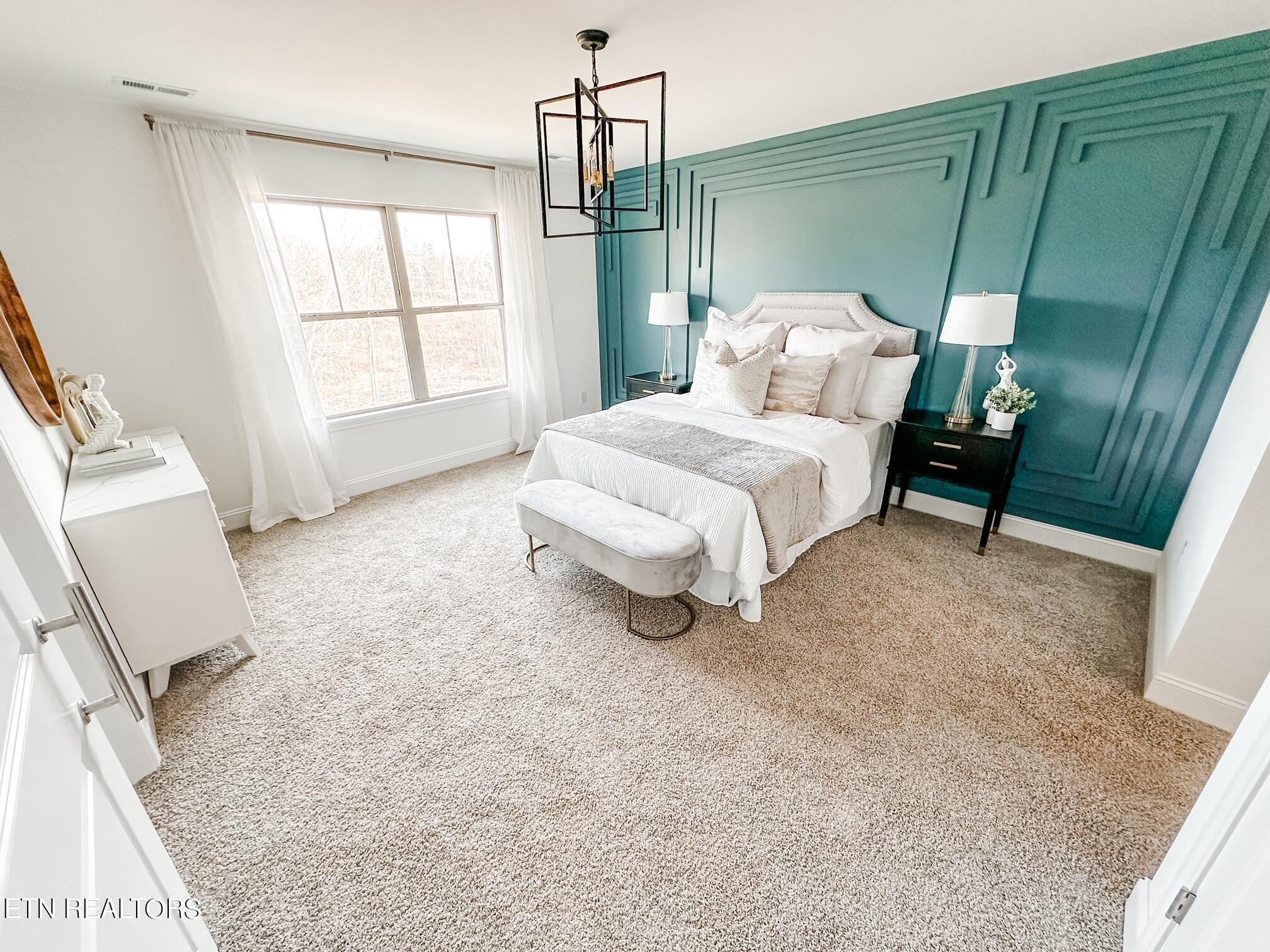 8405 Whisper Lane Powell, TN 37849 - Photo 18 of 39 a spacious bedroom with a bed and a window