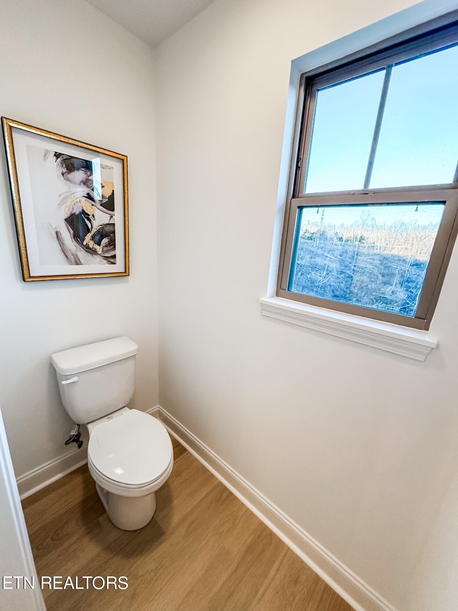 8405 Whisper Lane Powell, TN 37849 - Photo 22 of 39 a white toilet sitting next to a small window