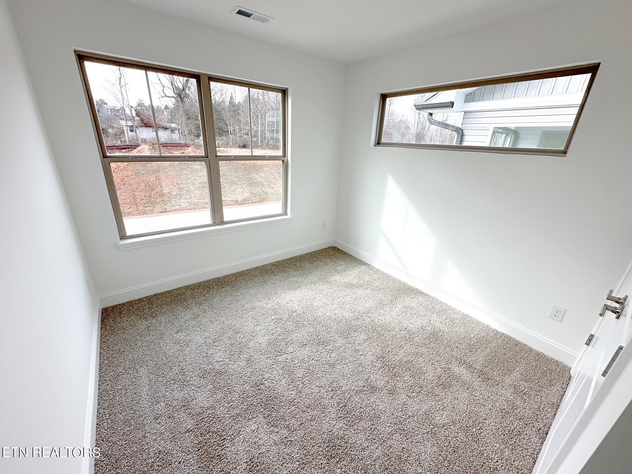 8405 Whisper Lane Powell, TN 37849 - Photo 26 of 39 an empty room with windows