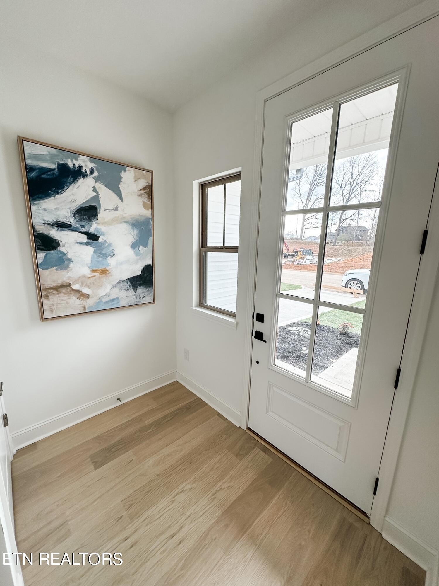 8405 Whisper Lane Powell, TN 37849 - Photo 3 of 39 an empty room with wooden floor and windows