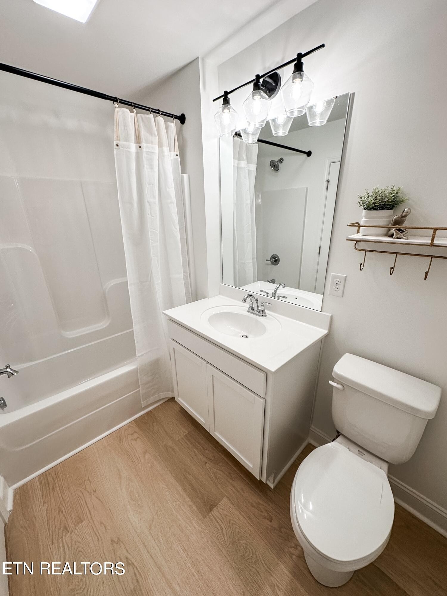 8405 Whisper Lane Powell, TN 37849 - Photo 32 of 39 a bathroom with a sink toilet and shower