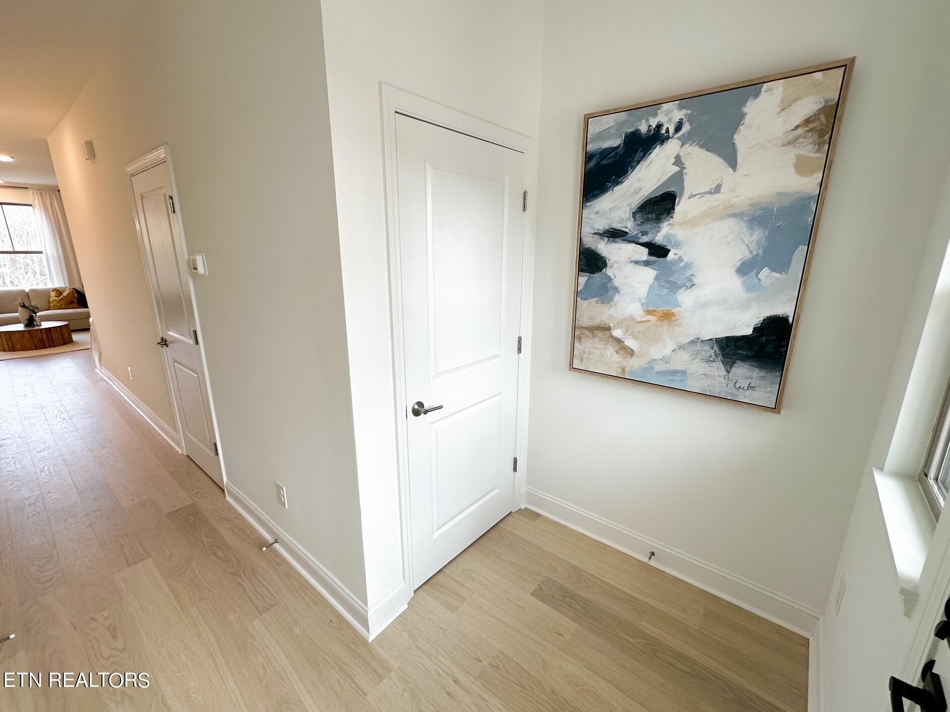 8405 Whisper Lane Powell, TN 37849 - Photo 4 of 39 a view of a hallway view with wooden floor and staircase