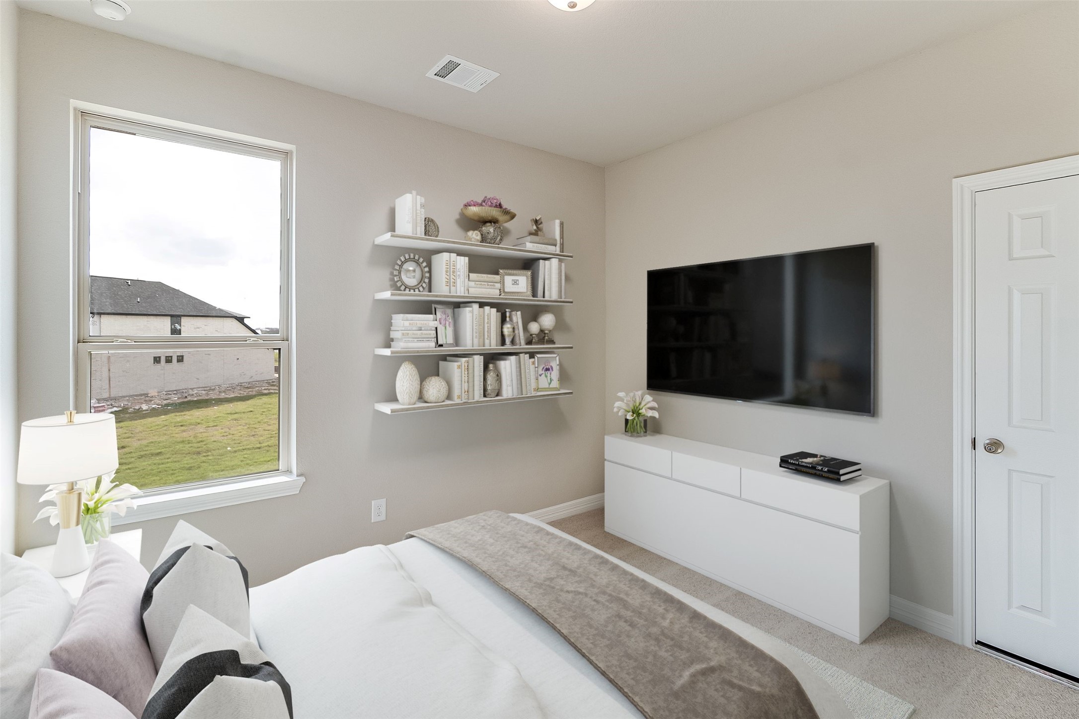 7907 Jasper Meadows Way Angleton, TX 77515 - Photo 17 of 34 a bedroom with a bed window and flat screen tv