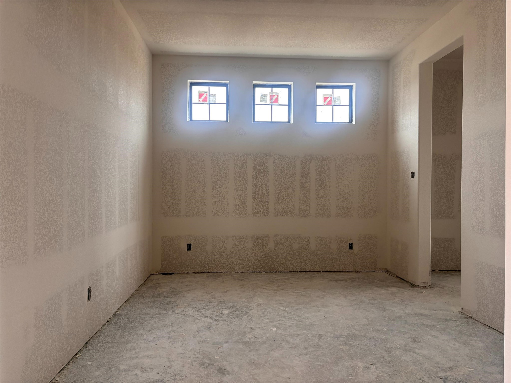 7907 Jasper Meadows Way Angleton, TX 77515 - Photo 21 of 34 an empty room with a window and a bathroom