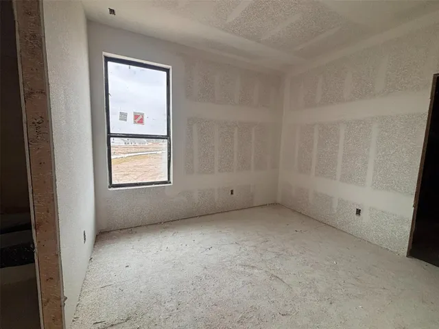 a view of a street with a building in the background