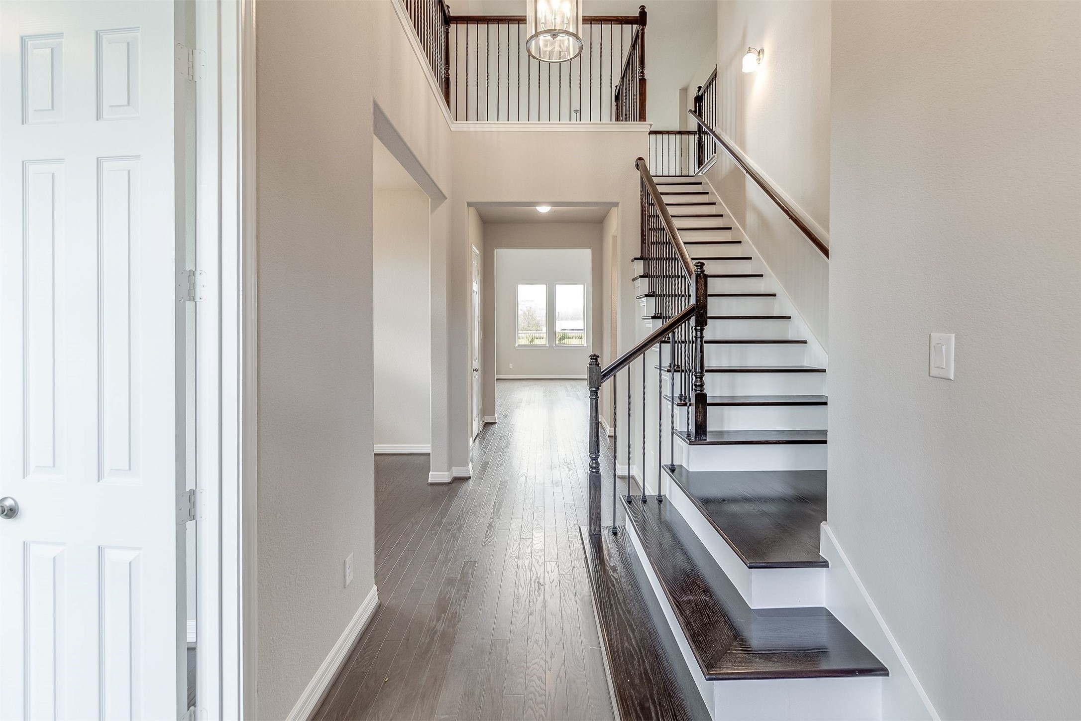 7907 Jasper Meadows Way Angleton, TX 77515 - Photo 4 of 34 a view of entryway and hall with wooden floor