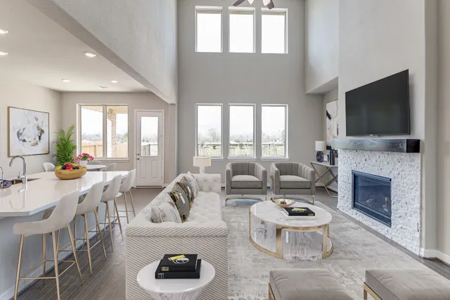 a living room with furniture fireplace and a flat screen tv